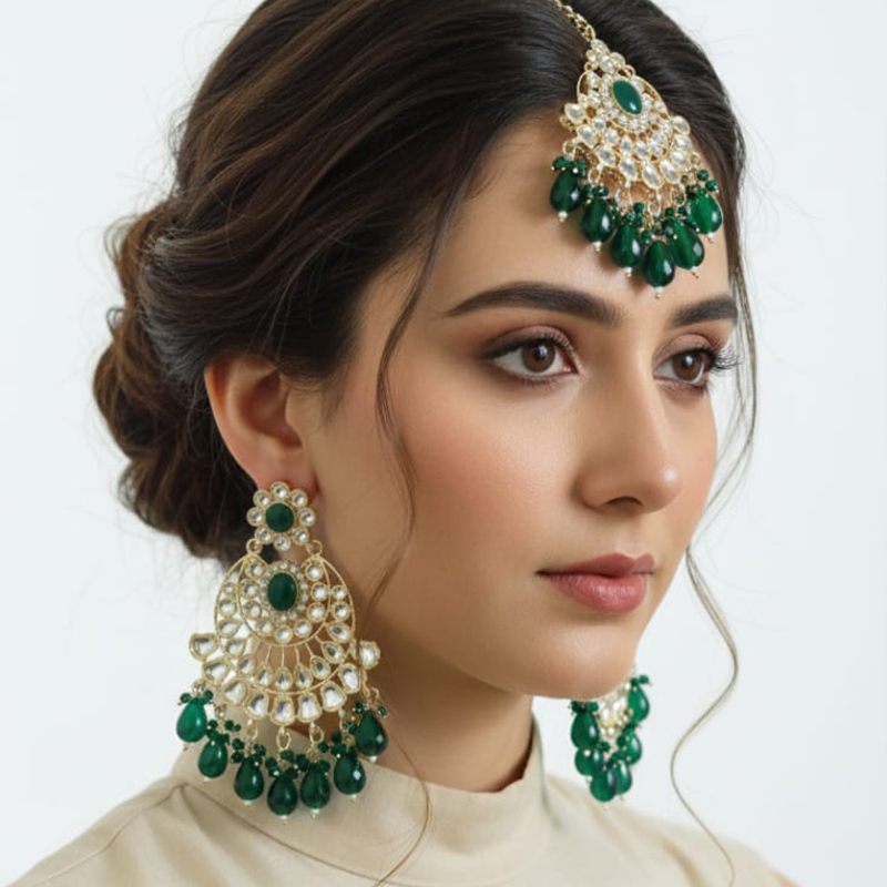 Heavy Kundan or Polki style large earrings and coordinating Maang Tikka
