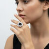Oval-cut stone, glossy black color,silver- toned, american diamond ring