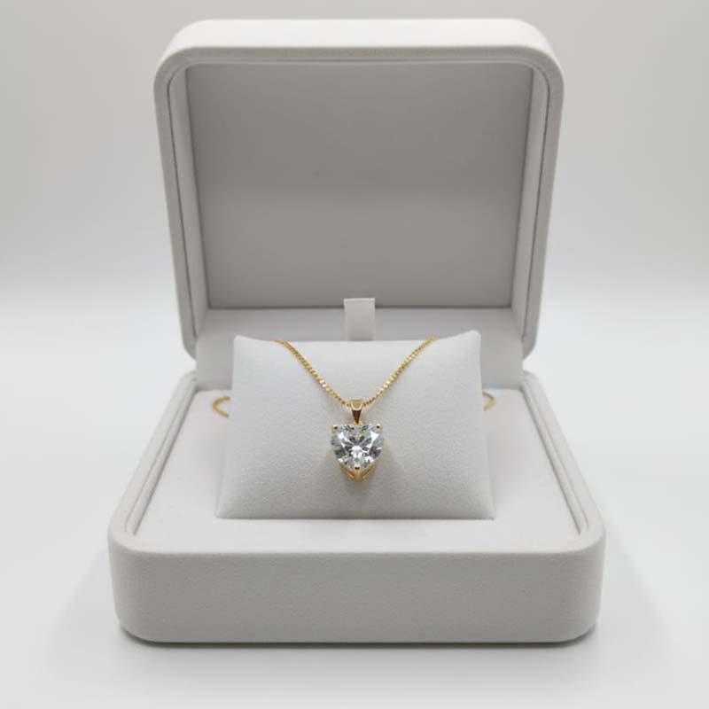 Symmetrical, heart-shaped, gold toned anti tarnish pendent