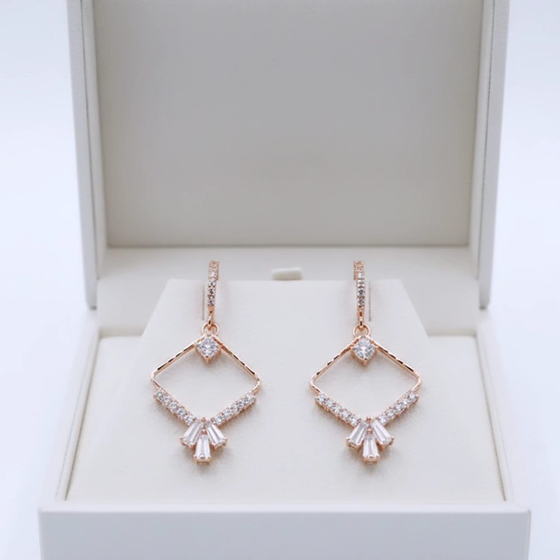 Divine rhombus diamond shape, rose-gold-toned drop earrings