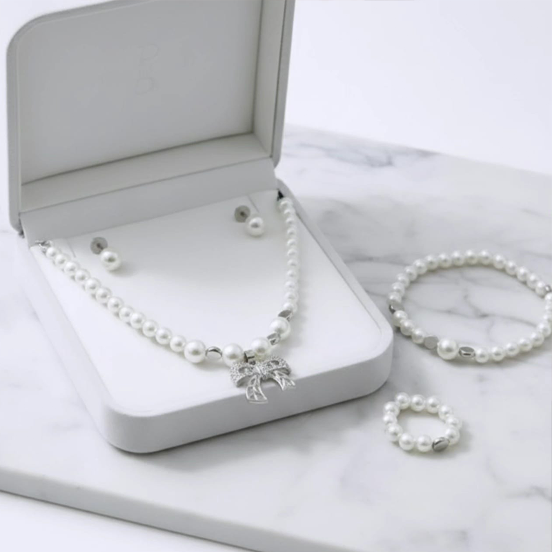 Classy white round pearls,silver-toned bow charm pearl jewellery set