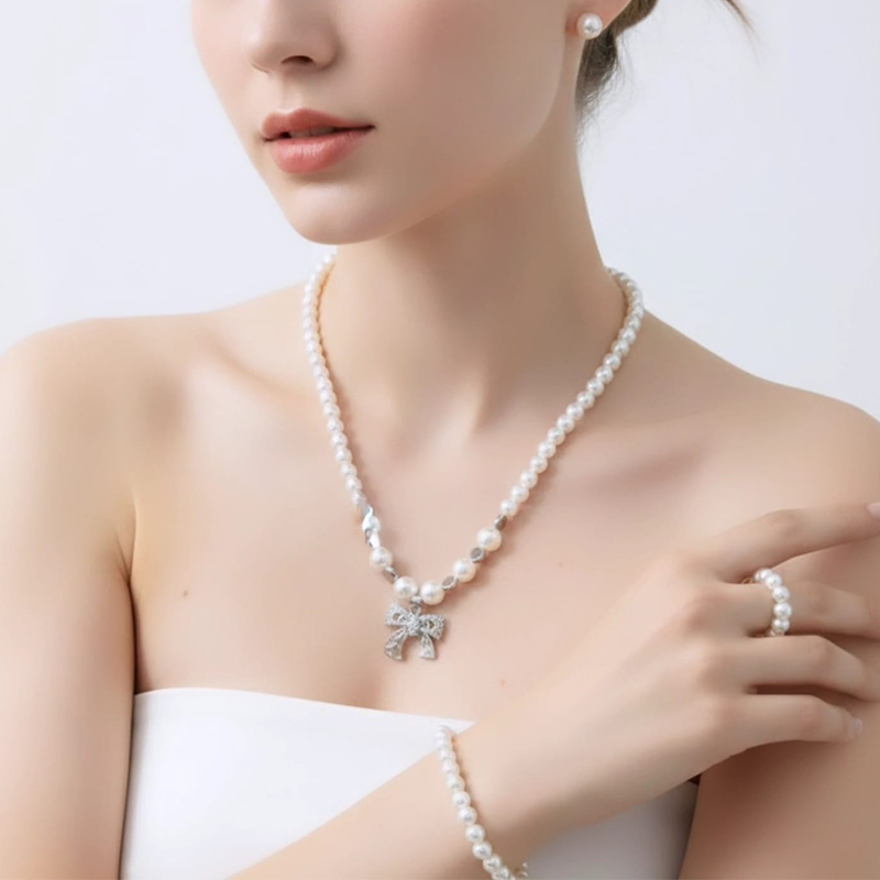 Classy white round pearls,silver-toned bow charm pearl jewellery set - Image 6