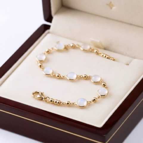 Divine round, cabochon-cut moonstones, station-style anti tarnish bracelet
