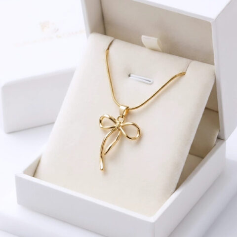 Elegant stylized ribbon bow design,sweeping curved tail anti tarnish pendant